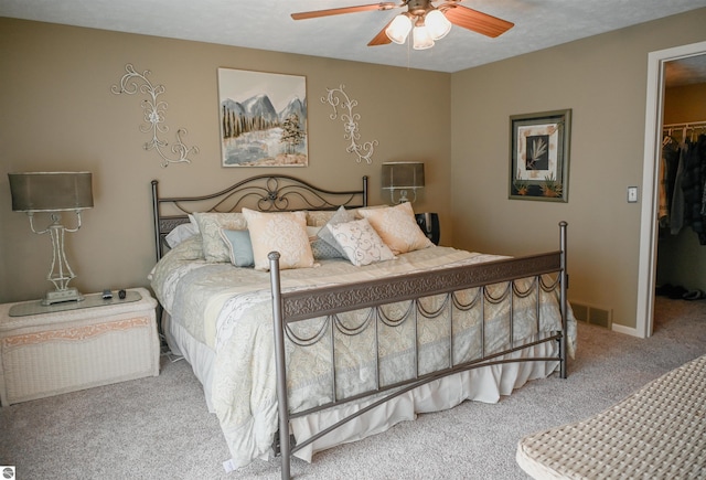 11255 E Fort Rd Unit H1, Suttons Bay, MI 49682 - carpeted bedroom with a spacious closet, a closet, and ceiling fan