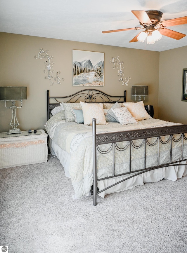 11255 E Fort Rd Unit H1, Suttons Bay, MI 49682 - carpeted bedroom featuring ceiling fan