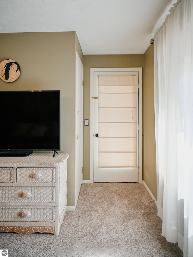 11255 E Fort Rd Unit H1, Suttons Bay, MI 49682 - bedroom with carpet and baseboards
