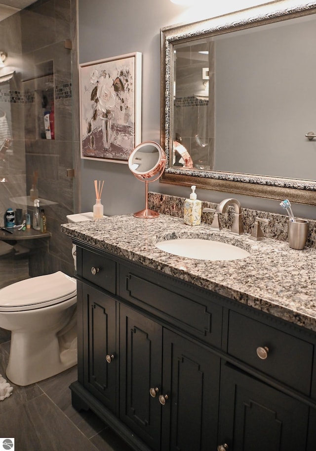 11255 E Fort Rd Unit H1, Suttons Bay, MI 49682 - bathroom with a shower stall, vanity, and toilet