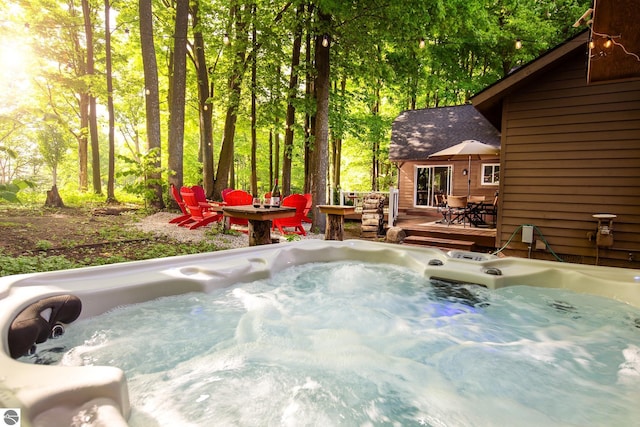 5540 Golf Meadows Dr, Bellaire, MI 49615 - view of patio / terrace featuring a hot tub, outdoor dining area, and a deck