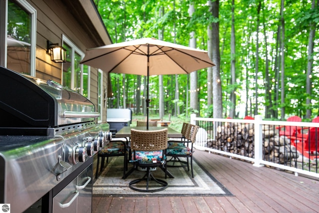 5540 Golf Meadows Dr, Bellaire, MI 49615 - wooden terrace featuring outdoor dining space