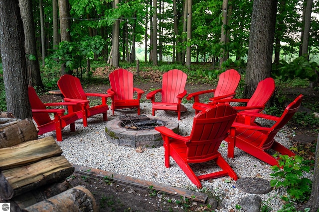 5540 Golf Meadows Dr, Bellaire, MI 49615 - view of patio / terrace featuring an outdoor fire pit
