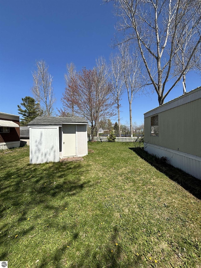4505 Goldenrod Dr, Traverse City, MI 49685 - view of yard featuring a shed and an outdoor structure
