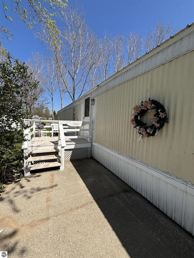 4505 Goldenrod Dr, Traverse City, MI 49685 - view of side of property with a wooden deck