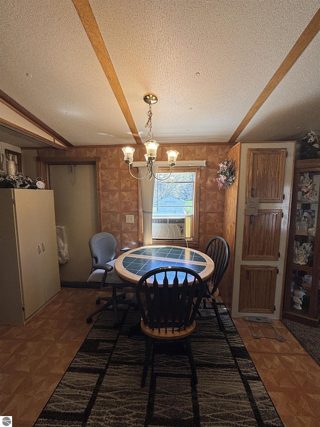 4505 Goldenrod Dr, Traverse City, MI 49685 - dining area featuring a textured ceiling, a chandelier, and cooling unit