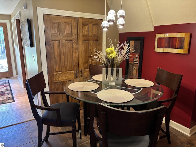 2050 Hiawatha Dr, Cadillac, MI 49601 - dining area featuring baseboards and a chandelier