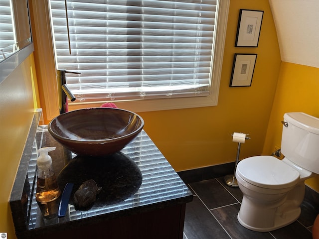 2050 Hiawatha Dr, Cadillac, MI 49601 - bathroom with toilet, baseboards, and tile patterned floors