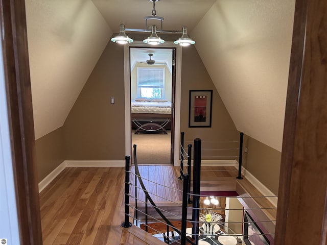 2050 Hiawatha Dr, Cadillac, MI 49601 - additional living space featuring wood finished floors, lofted ceiling, and baseboards