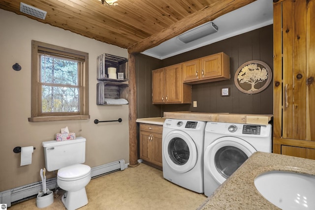 512 Indiana St, Manton, MI 49663 - clothes washing area featuring washing machine and dryer, baseboard heating, wood ceiling, and a sink