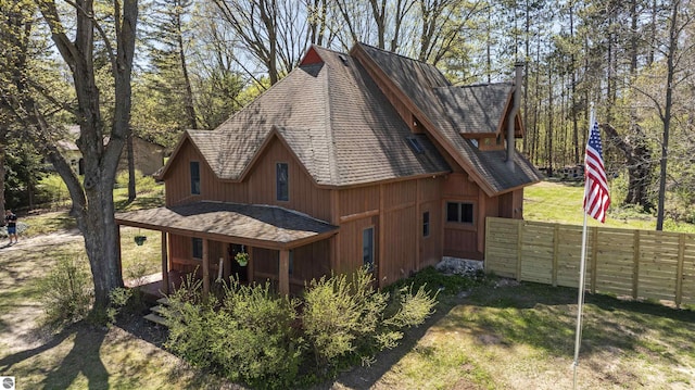 512 Indiana St, Manton, MI 49663 - view of side of property featuring fence and roof with shingles