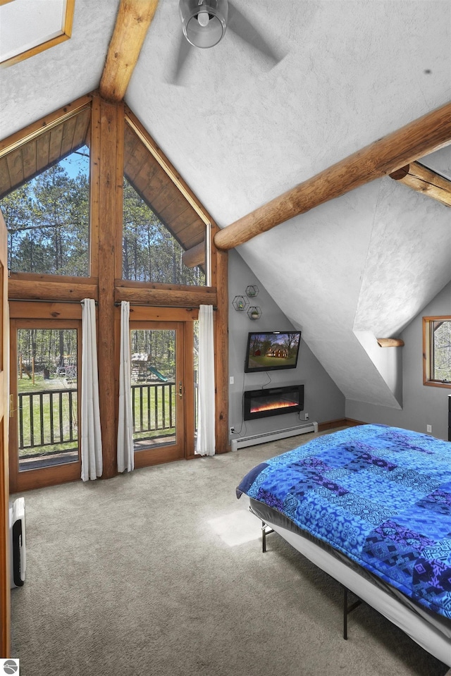 512 Indiana St, Manton, MI 49663 - carpeted bedroom featuring baseboard heating, multiple windows, and access to outside