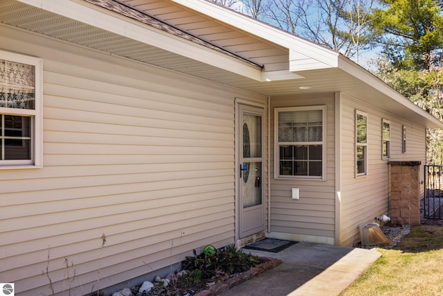 9803 Deer Track Ct, Interlochen, MI 49643 - view of exterior entry with fence
