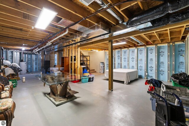 9803 Deer Track Ct, Interlochen, MI 49643 - unfinished basement featuring gas water heater