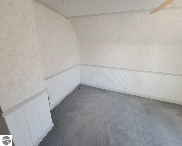442 E Harris St, Cadillac, MI 49601 - unfurnished room with dark carpet, wainscoting, and wallpapered walls
