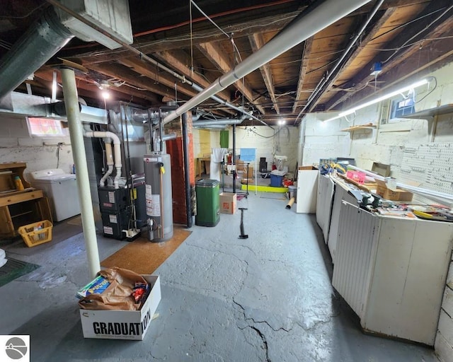 442 E Harris St, Cadillac, MI 49601 - below grade area with gas water heater, separate washer and dryer, and heating unit