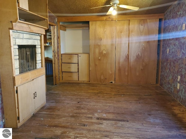 312 S Brown St, Edmore, MI 48829 - empty room with hardwood / wood-style flooring and ceiling fan