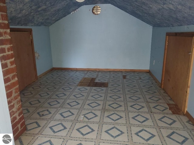 312 S Brown St, Edmore, MI 48829 - bonus room with lofted ceiling and baseboards