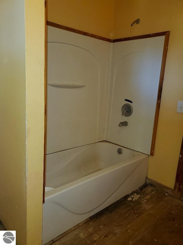 312 S Brown St, Edmore, MI 48829 - bathroom featuring wood finished floors and baseboards