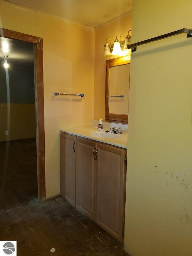 312 S Brown St, Edmore, MI 48829 - bathroom with vanity and wood finished floors