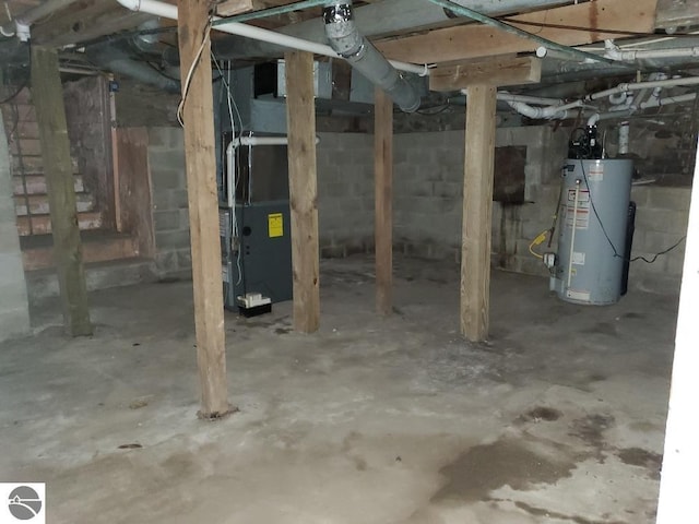 312 S Brown St, Edmore, MI 48829 - unfinished basement with gas water heater
