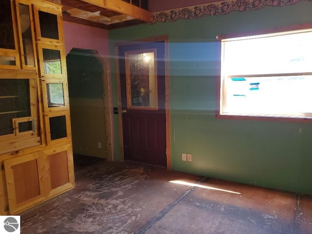 312 S Brown St, Edmore, MI 48829 - empty room featuring arched walkways