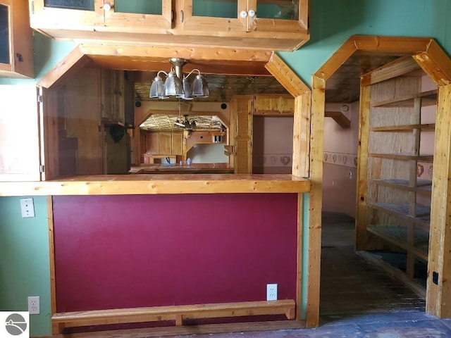 312 S Brown St, Edmore, MI 48829 - bar featuring a chandelier