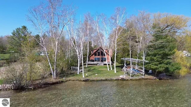 3972 US-31 N, Kewadin, MI 49648 - dock area featuring a water view and a yard