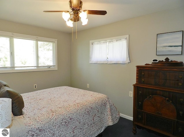 915 N Sunset Shores Dr, Lake Leelanau, MI 49653 - bedroom with ceiling fan and carpet