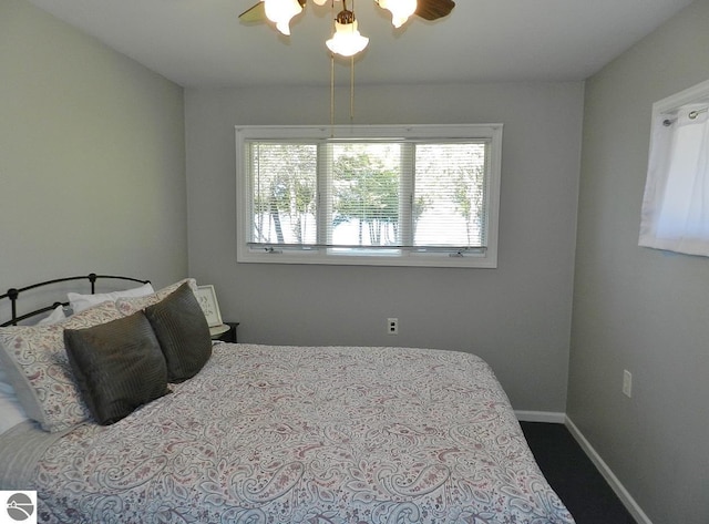 915 N Sunset Shores Dr, Lake Leelanau, MI 49653 - bedroom featuring baseboards and a ceiling fan