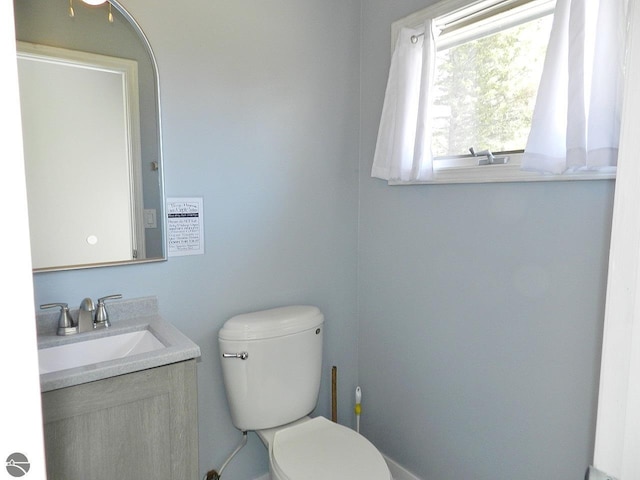 915 N Sunset Shores Dr, Lake Leelanau, MI 49653 - half bathroom with vanity and toilet