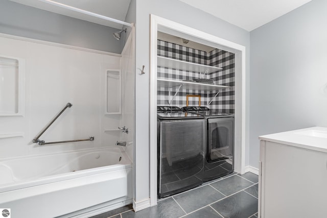 6450 W Lincoln Rd, Elwell, MI 48832 - bathroom featuring shower / washtub combination, tile patterned flooring, and vanity