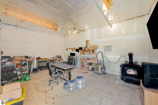 6450 W Lincoln Rd, Elwell, MI 48832 - miscellaneous room with a wood stove, unfinished concrete floors, and a wall mounted air conditioner