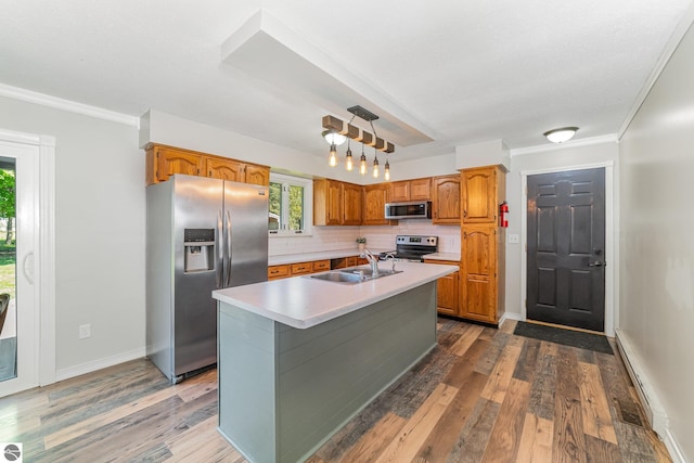 6450 W Lincoln Rd, Elwell, MI 48832 - kitchen with appliances with stainless steel finishes, a sink, light countertops, dark wood finished floors, and decorative backsplash