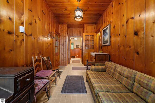 7548 S Dune Hwy, Empire, MI 49630 - sitting room with wooden walls, wooden ceiling, and light flooring
