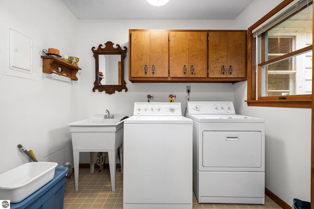 7548 S Dune Hwy, Empire, MI 49630 - laundry area with cabinet space and separate washer and dryer