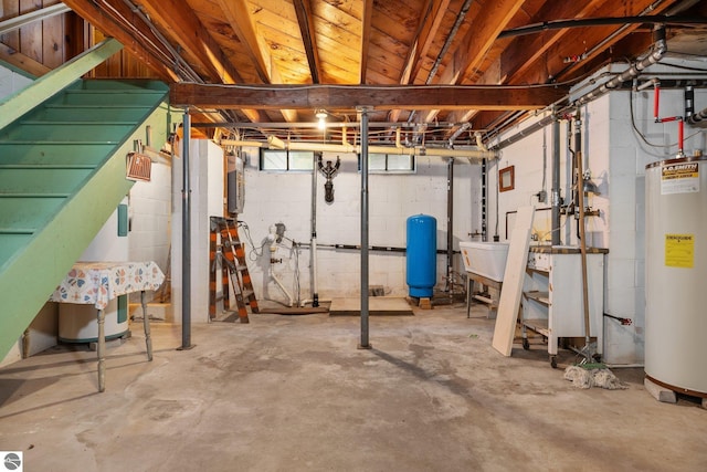 7548 S Dune Hwy, Empire, MI 49630 - basement with a water pressure tank, water heater, stairway, and a sink