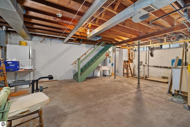 7548 S Dune Hwy, Empire, MI 49630 - unfinished below grade area featuring electric water heater and stairway