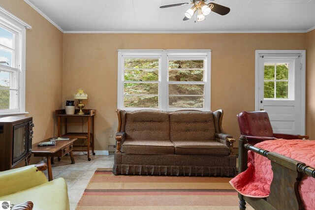 7548 S Dune Hwy, Empire, MI 49630 - living room featuring ceiling fan, baseboards, light tile patterned floors, and ornamental molding