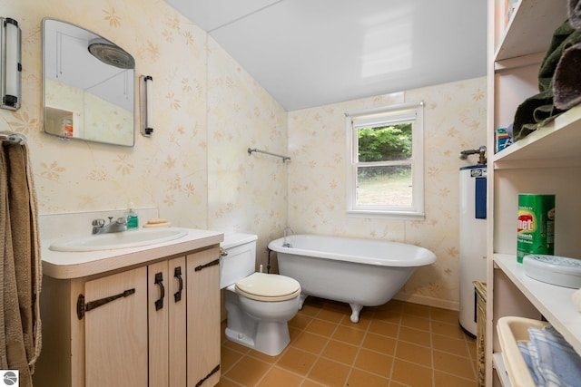 7548 S Dune Hwy, Empire, MI 49630 - full bath with a freestanding tub, vanity, toilet, water heater, and tile patterned floors