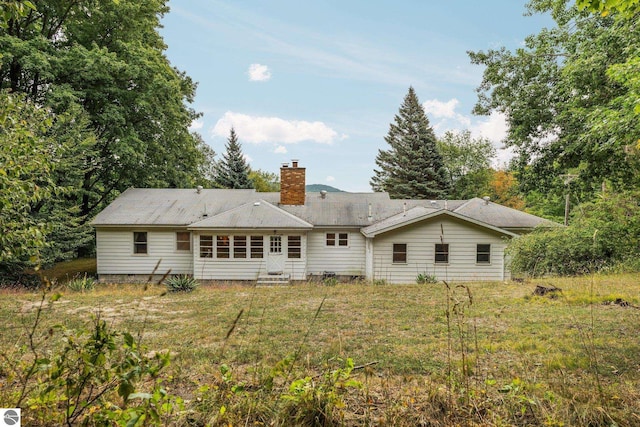 7548 S Dune Hwy, Empire, MI 49630 - rear view of house with a chimney and entry steps