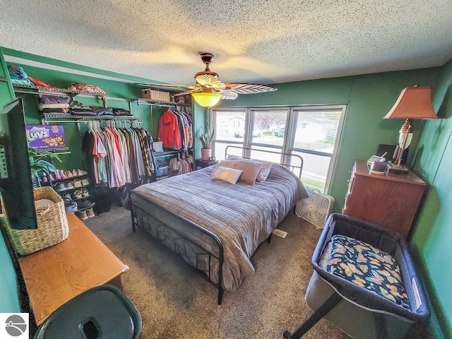 411 S Grover Ave Lot 39, Alma, MI 48801 - bedroom with a textured ceiling, a closet, carpet floors, and a ceiling fan