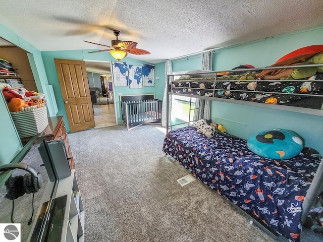411 S Grover Ave Lot 39, Alma, MI 48801 - carpeted bedroom with a textured ceiling and a ceiling fan