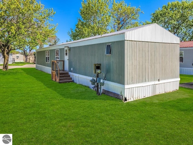 411 S Grover Ave Lot 39, Alma, MI 48801 - back of house with a lawn