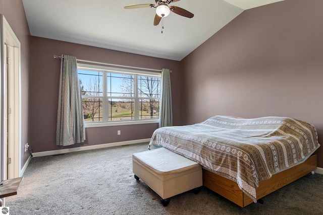 8233 Barney Rd, Traverse City, MI 49684 - bedroom with vaulted ceiling, carpet, baseboards, and ceiling fan