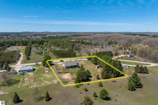 8233 Barney Rd, Traverse City, MI 49684 - aerial view of property and surrounding area featuring property parcel outlined and a forest