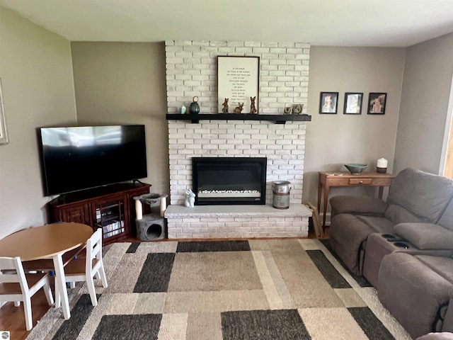913 Mill St, Alma, MI 48801 - living area featuring a brick fireplace