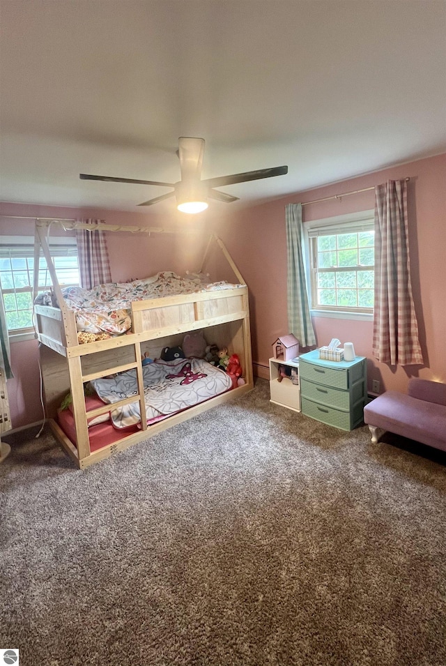 913 Mill St, Alma, MI 48801 - bedroom with carpet floors and a ceiling fan
