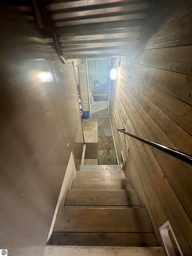 913 Mill St, Alma, MI 48801 - stairway featuring wooden walls