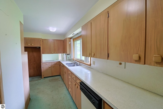 8670 E Pickard Rd, Mount Pleasant, MI 48858 - kitchen featuring white dishwasher, light countertops, a sink, and light colored carpet